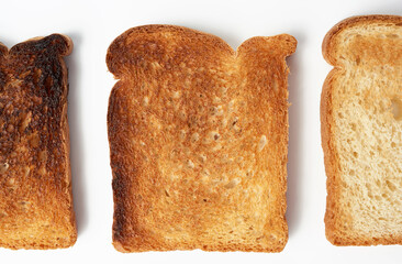 square slices of bread made from white wheat flour toasted in a toaster