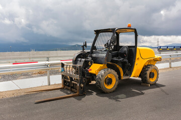 Exterior small forklift at road construction works