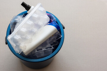 Plastic trash in a bucket top view. Recycling of plastic waste. Separate waste collection. Environmental pollution. Plastic garbage. Caring for the environment on Earth.