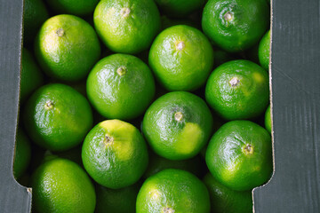 fresh limes on the market stall