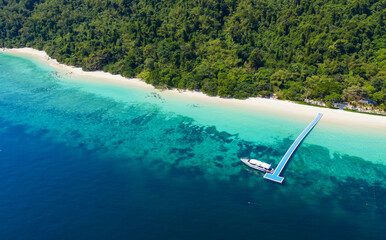 Aerial view ocean waves, beach and rocky coastline and beautiful forest. Nyaung Oo Phee Island...