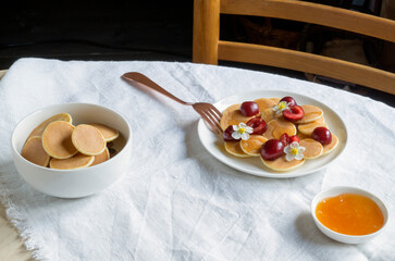  small pancakes with berries for Breakfast.