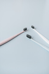 Toothbrushes on blue background. Oral care, dental hygiene concept.