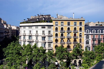 Fototapeta premium Top view on Gracia avenue with luxurious buildings in Barcelona city