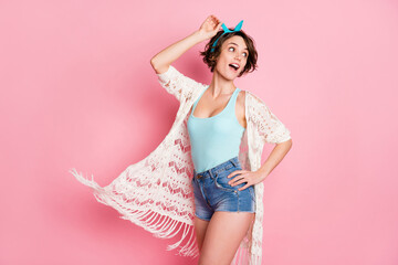 Portrait of her she nice attractive lovely fashionable charming pretty cheerful cheery girl air wind blowing looking back enjoying isolated over pink pastel color background