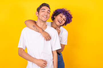 happy young couple isolated on color background