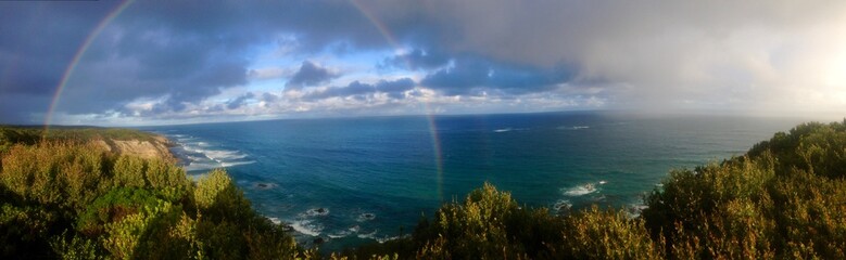Beautiful coastline from cliff with rainbow
