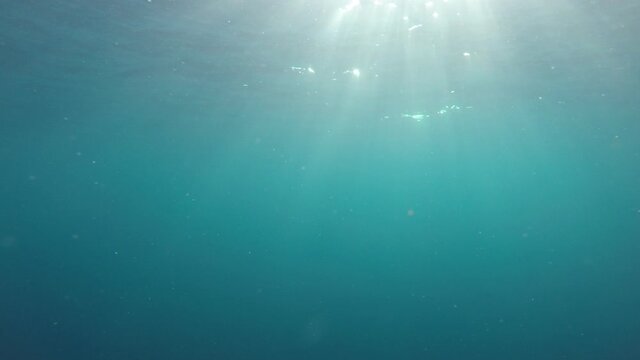 Underwater video of sunburst in ocean 