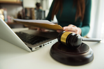 justice and law concept.Male judge in a courtroom on table and Counselor or Male lawyer working in office. Legal law, advice and justice concept.