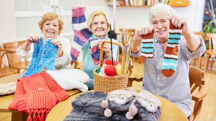 Seniors proudly display self-knitted socks