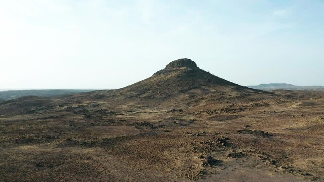 Aerial Flyover Of Arid Region Landscape With Mountain, India