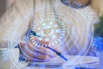 Multi exposure of writing hands on background with data solution hologram. Technology concept.