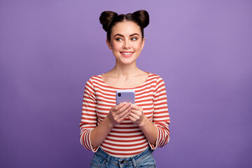 Photo of funny lady hold telephone hands addicted blogger look cunning side empty space tricky mood...