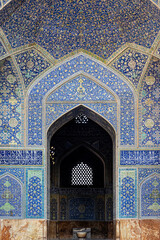 Blue colored mosaic and textured ceiling at the entrance of Shah Mosque in Isfahan, Iran