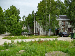 Surgut, Khanty-Mansi Autonomous Okrug / Russia - 06.09.2020: Old houses made of wood and plastered in which people still live