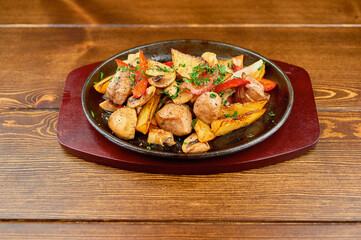 A plate of food sitting on top of a wooden table