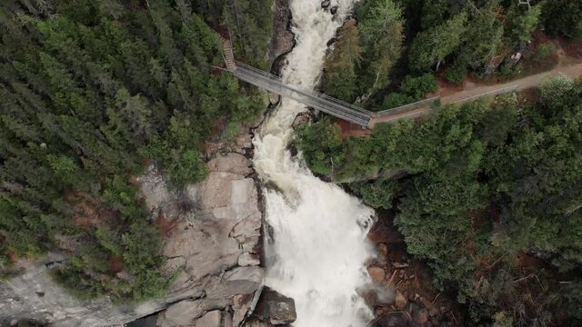 Natural Landscape Of Chute Neigette Waterfall By The Green Forest At Rimouski, Quebec, Canada. - aerial drone shot