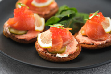 Russian pancakes with salmon and red caviar