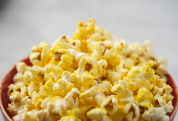 Salted Cheese Popcorn in a Brown Bowl.