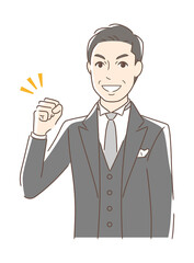 ガッツポーズする男性