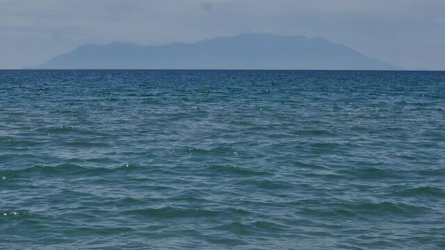 The island of Samothraki in Greece. In the foreground is the Aegean Sea.