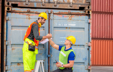 Engineer and worker soul brother handshake, thumb clasp handshake or homie handshake with blurred containers cargo background, Success and Teamwork concept