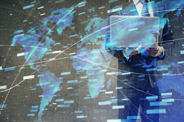 Double exposure of data internet theme hologram with man working on computer on background. Concept of innovation.