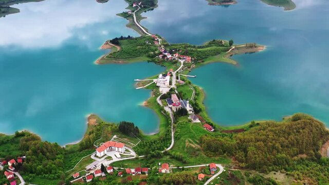 Aerial reverse above Ramsko turquoise lake, Bosnia and Herzegovina