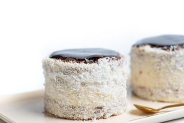 Homemade coconut cake with chocolate on a plate