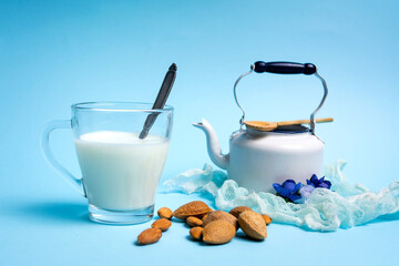 Almond Milk in a Glass on blue background