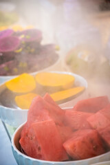 Delicious freshly cut fruits on sale on market