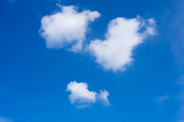 Three clouds formed a face-like shape