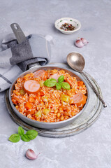 Stewed rice with beans, sausages and vegetables