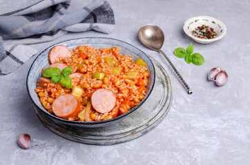Stewed rice with beans, sausages and vegetables