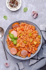 Stewed rice with beans, sausages and vegetables