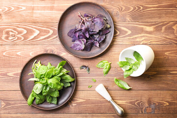 Composition with fresh basil on wooden table