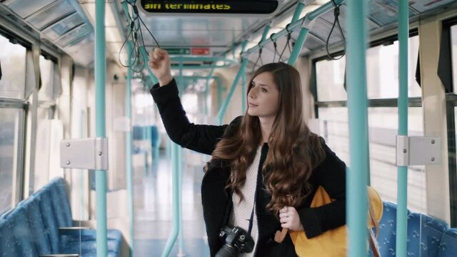 Tourist Photographer on Train Ride Alone