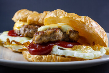 Croissant Hamburger home made in dish with dark background 