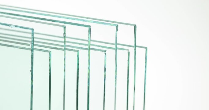 Sheets of Factory manufacturing tempered clear float glass panels cut to size.