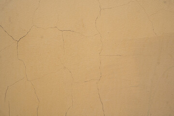 Background image of the texture of a painted cracked wall