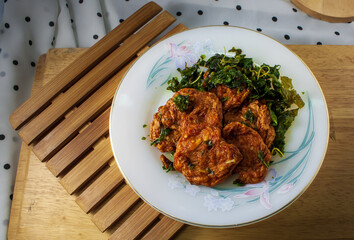 Fried Fish Cakes in ceramic plate and wooden board