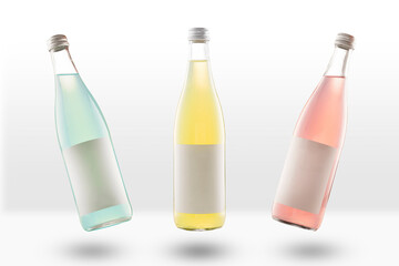three glass bottles of lemonade and fizzy drinks, with empty mockup labels. yellow, pink and light...