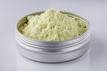 purified sulfur powder on a white acrylic background