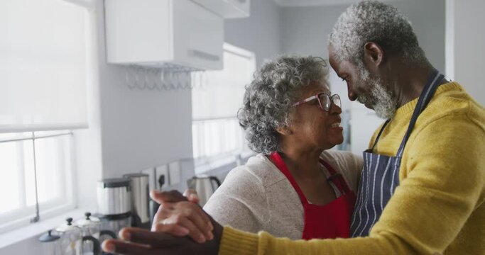 A senior African american couple dancing at home. Social distancing in quarantine