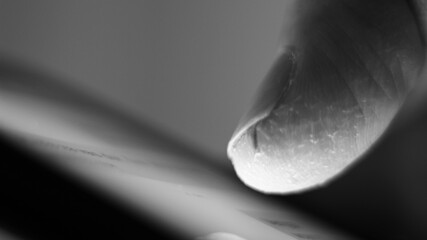 Obraz premium Macro of a finger on a mobile phone.