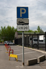 Paid parking road sign on city street.