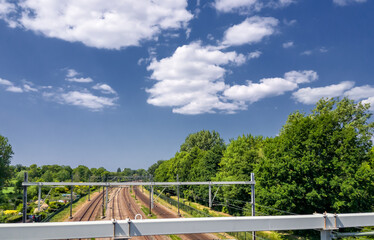 Friendly clouds above the railway track in Rijswijk (NL)