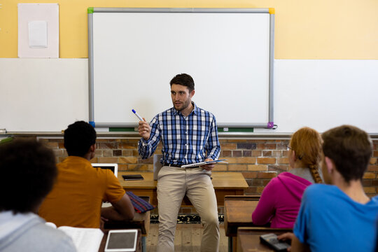Front view of teacher talking to his students