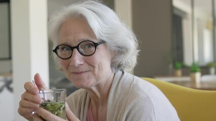 Portrait of senior woman drinking herbal tea