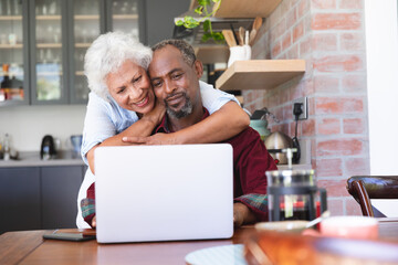 Senior African American couple using laptop